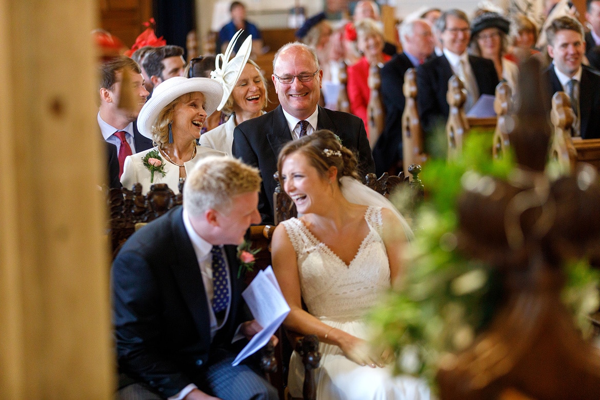 bride and groom and the family laugh