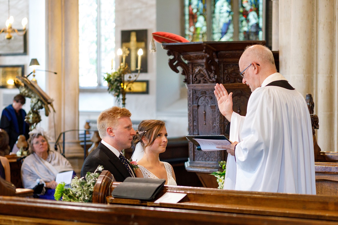 the vicar blesses the couple