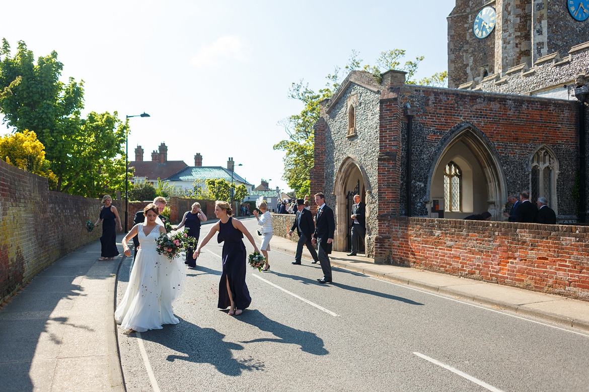 crossing the main road into aldeburgh brushing off confetti
