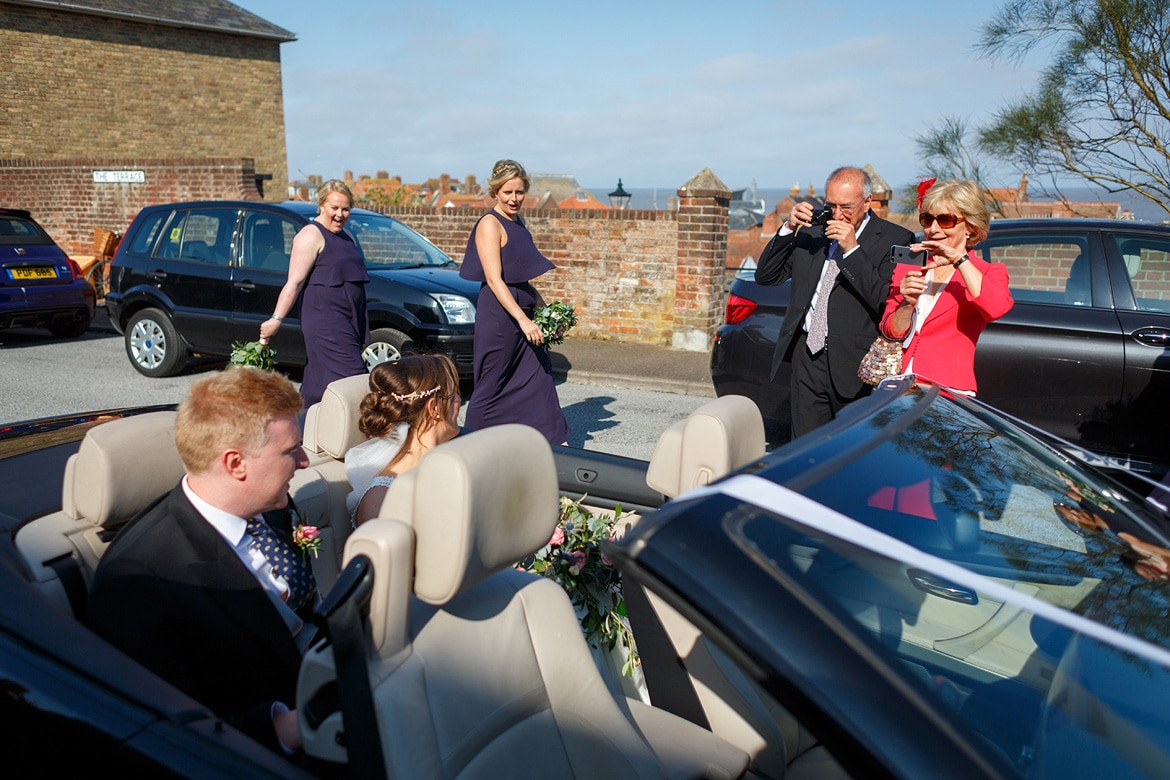 bride and groom in the wedding car