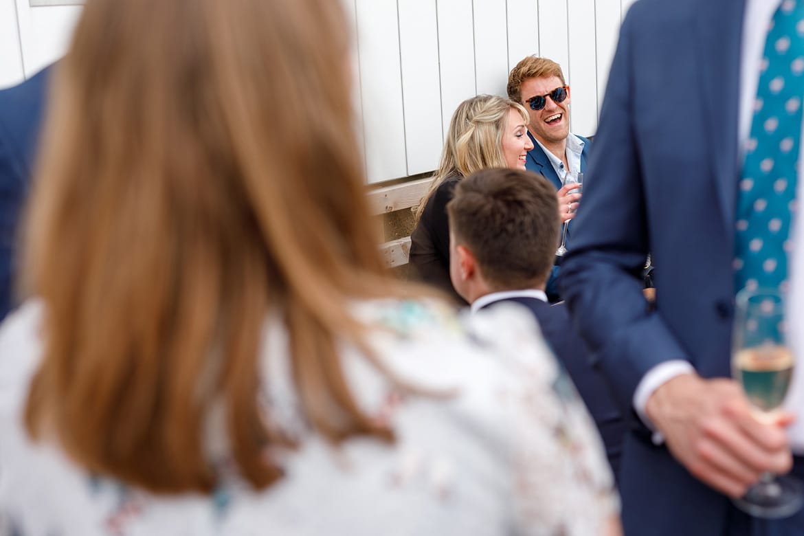 guests laughing at the drinks reception