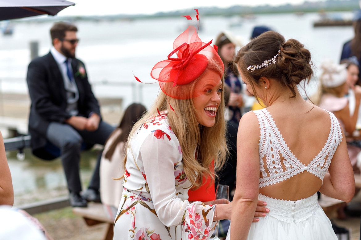 the bride enjoys a joke with her friends