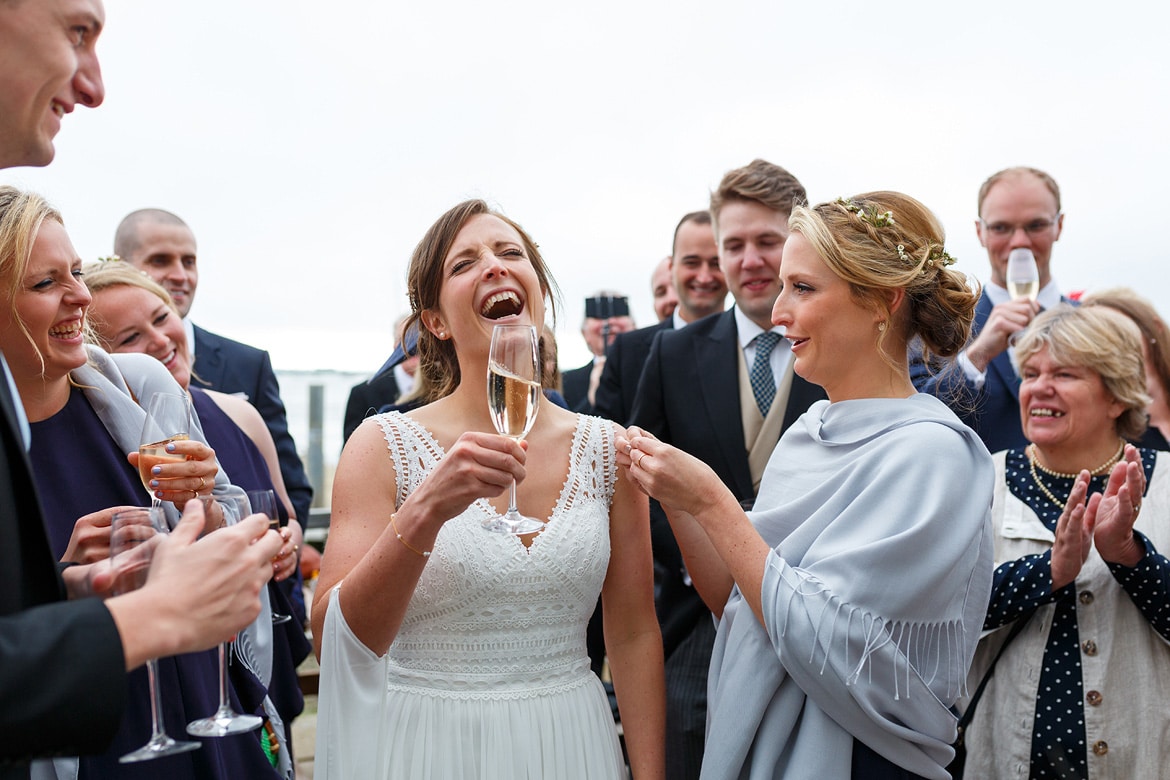 the brides sister pins a badge on her