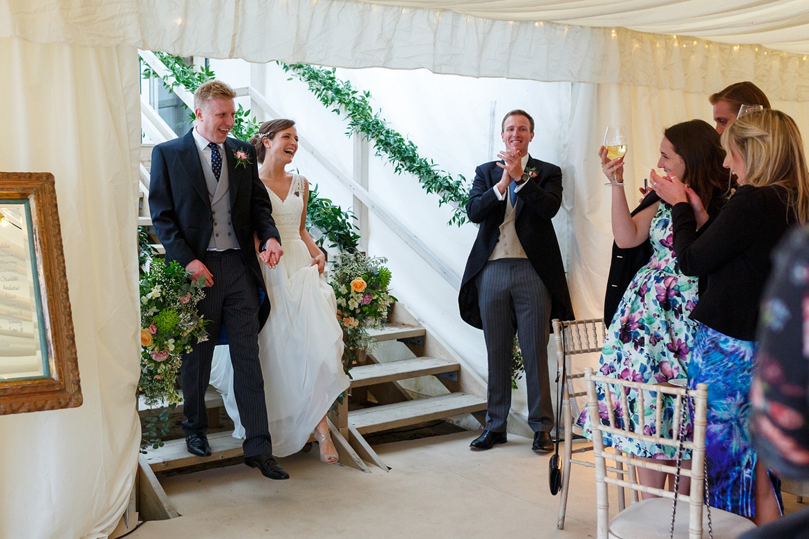 bride and groom are announced into the room