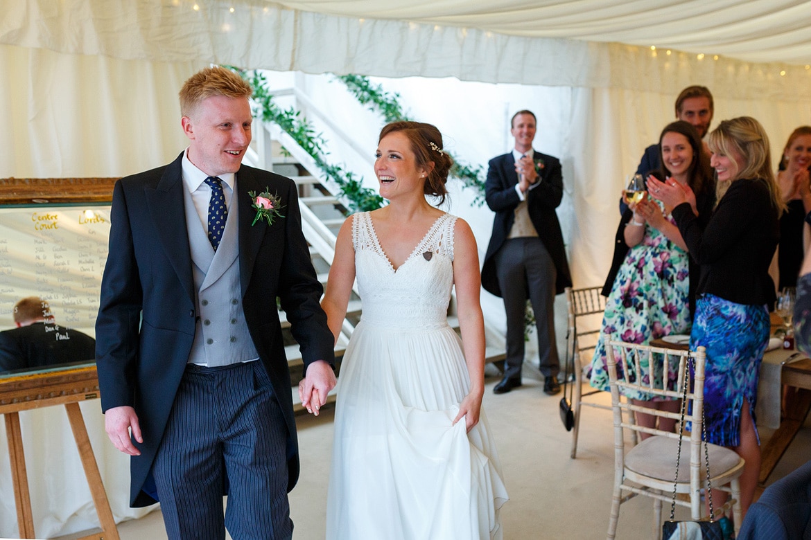 bride and groom are announced into the room