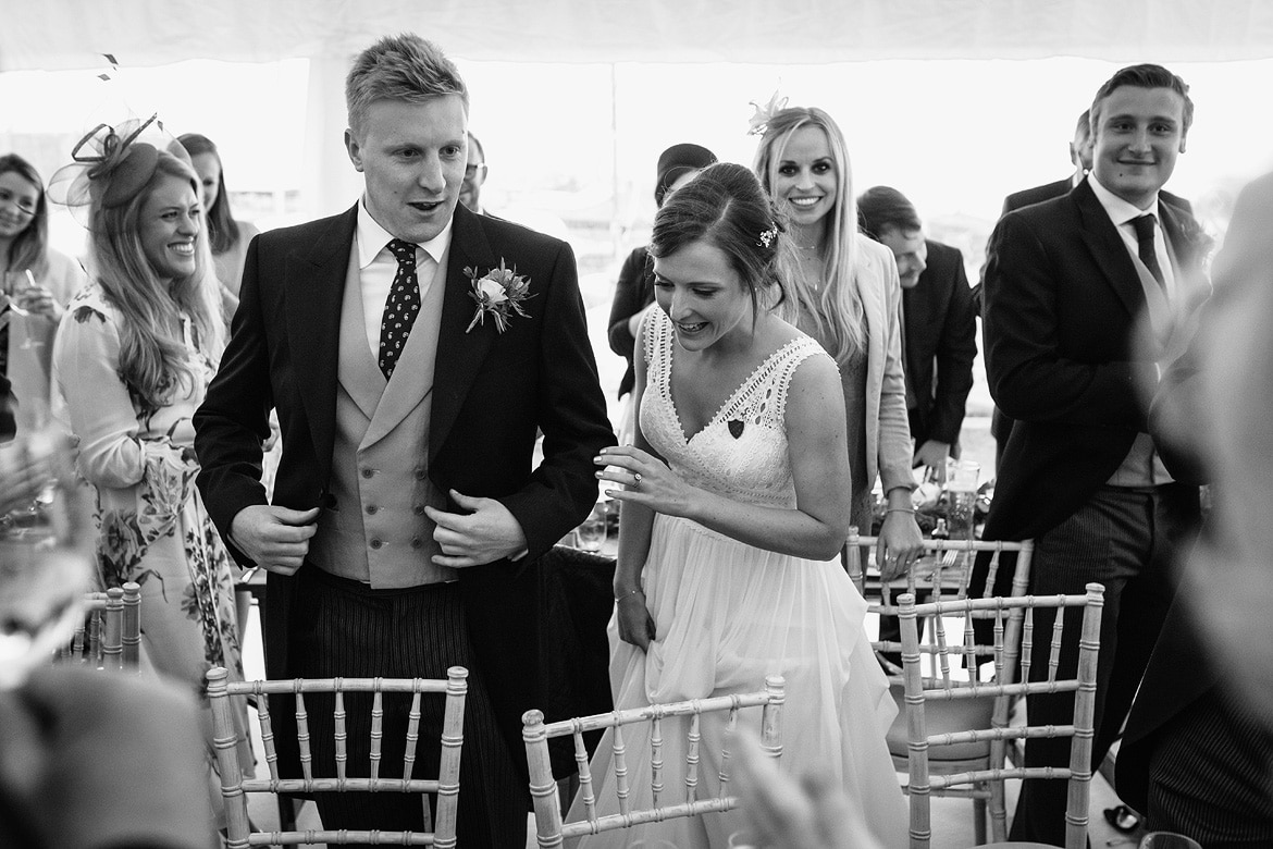 bride and groom take their seats