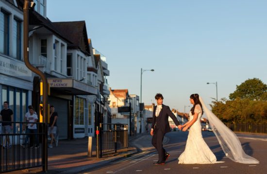 bride and groom cross the road to their arlington ballroom wedding