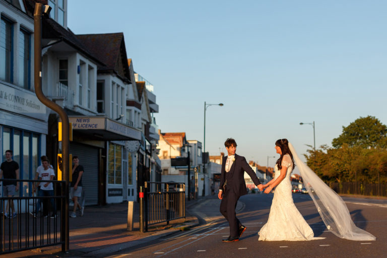 bride and groom cross the road to their arlington ballroom wedding