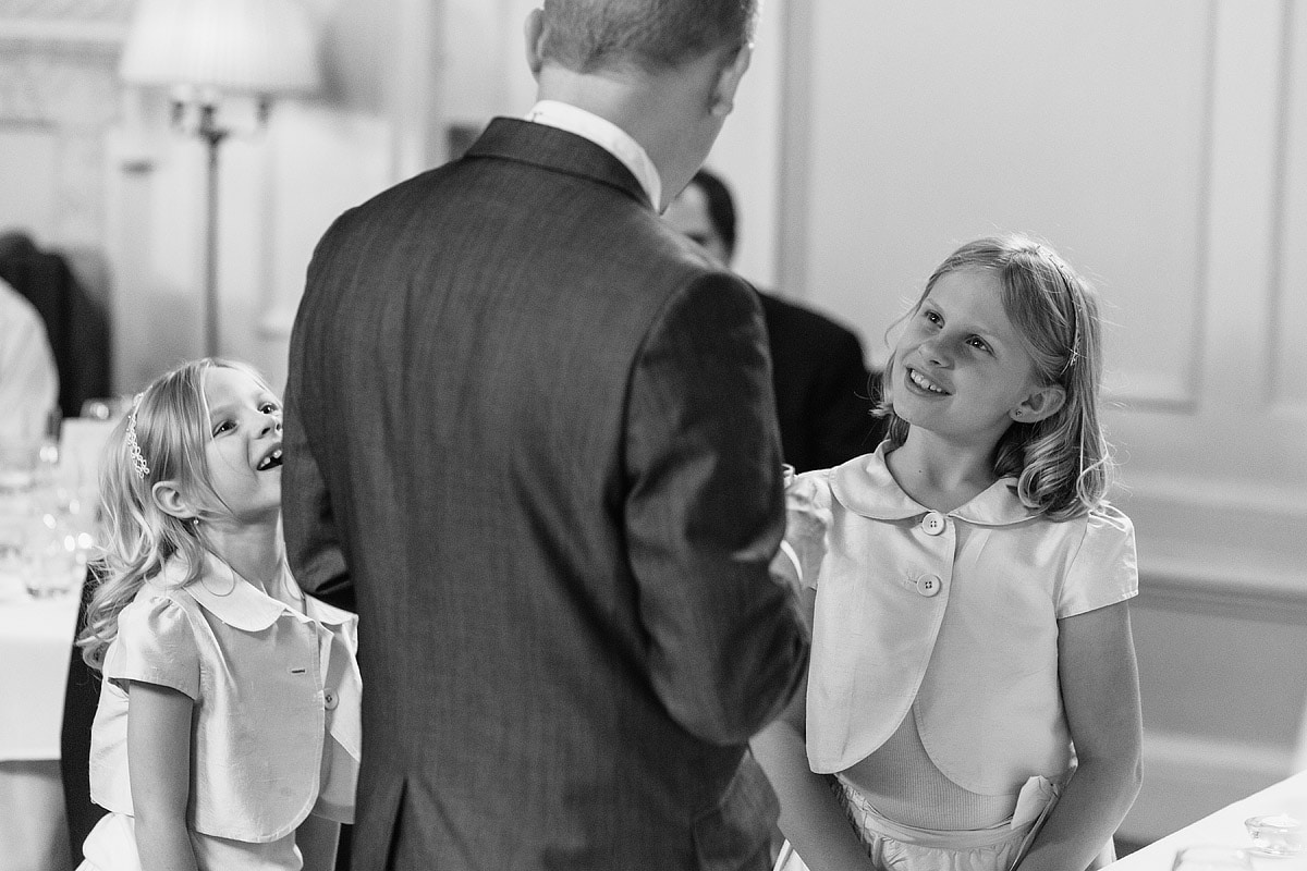 a flowergirl talks to the groom