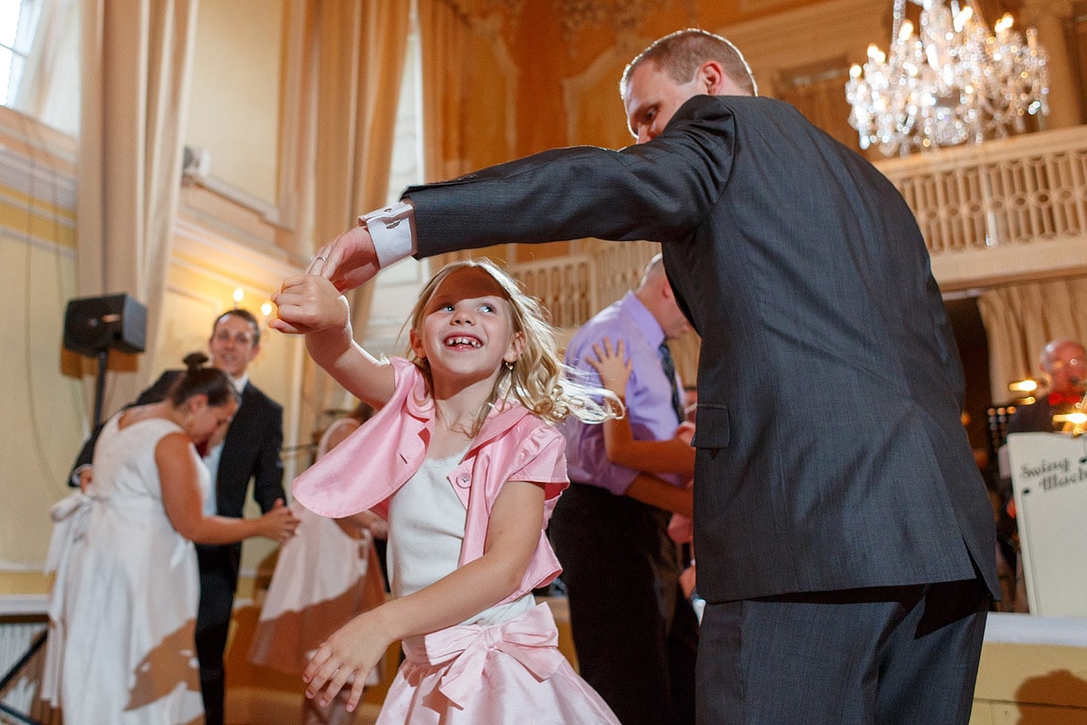 the groom dances with a flowergirl