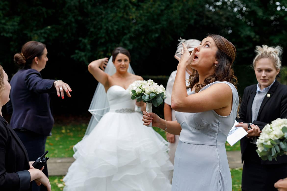 the brides sister has an emotional moment outside the church