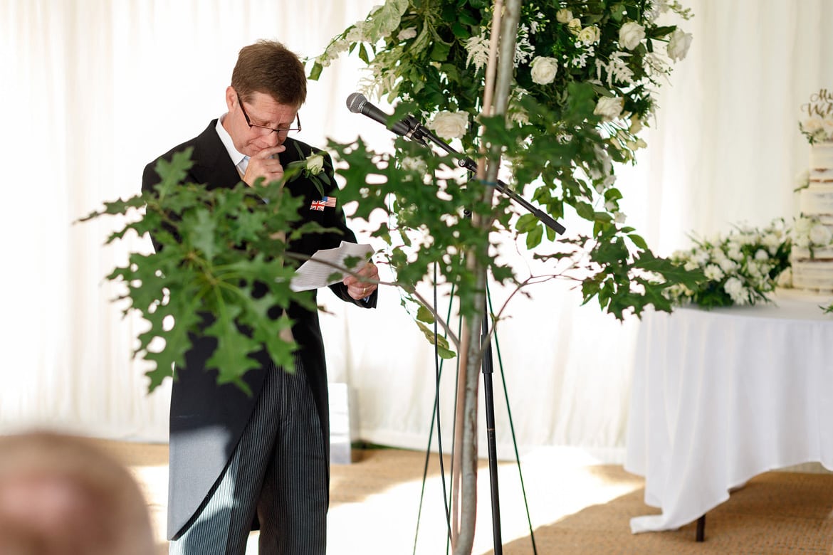 the father of the bride has a moment during his speech