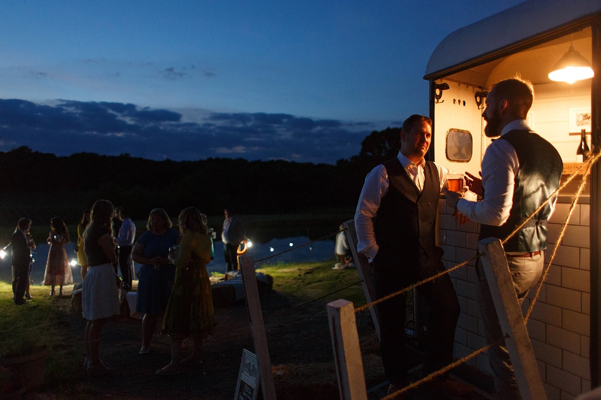 wedding guests at the evening outside bar