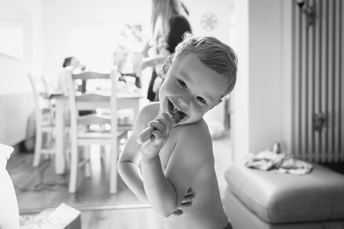 the brides son poses during the preparations