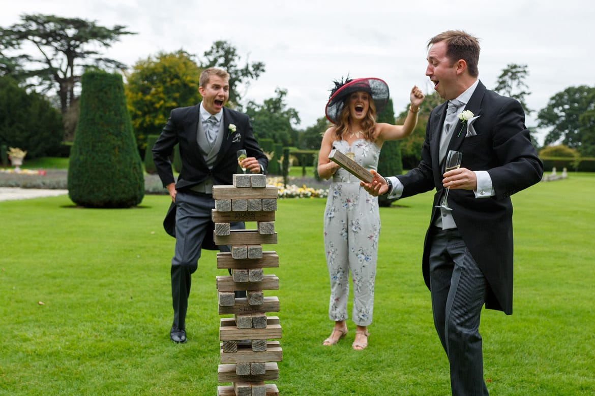 wedding guests playing jenga at a hengrave hall wedding