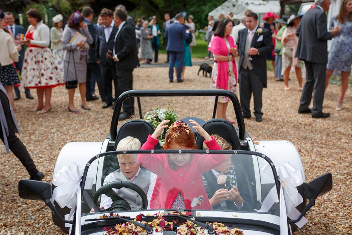 children in the wedding car