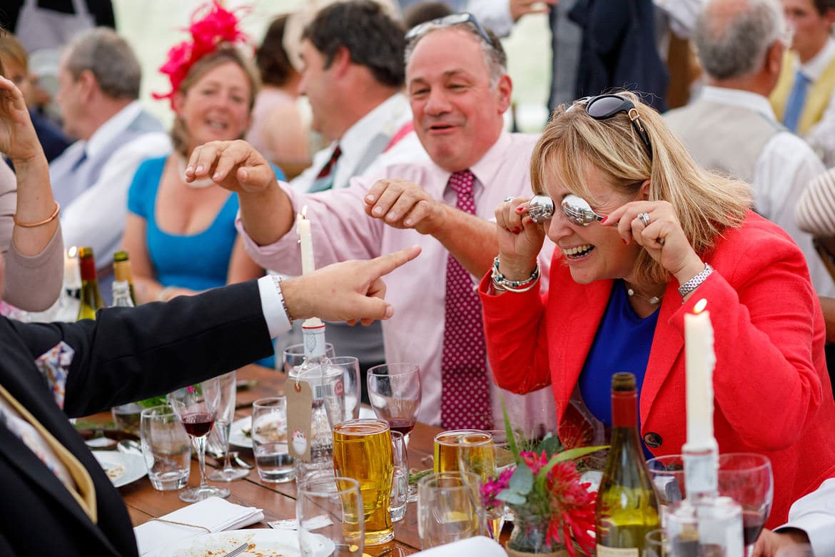 wedding guests fooling around with spoons