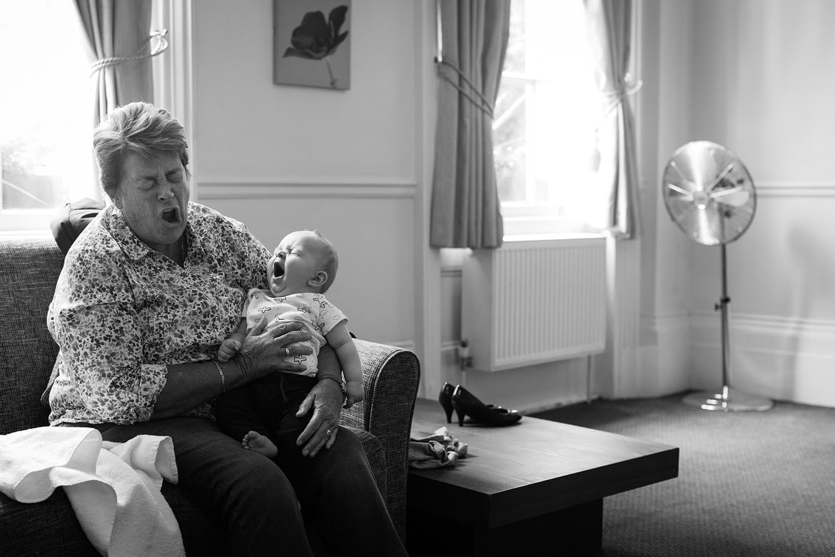 double yawns from a baby and her grandmother