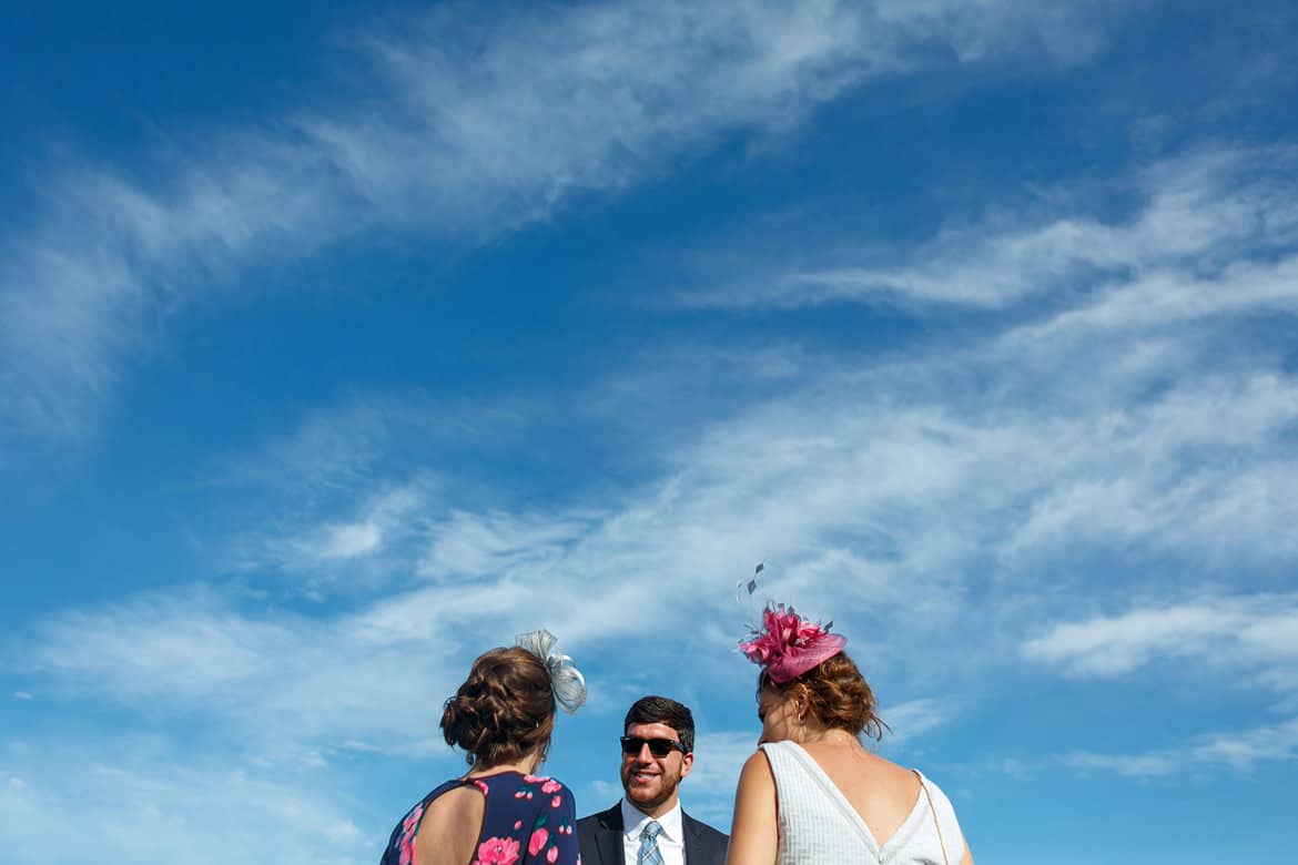 wedding guests under a summer sky