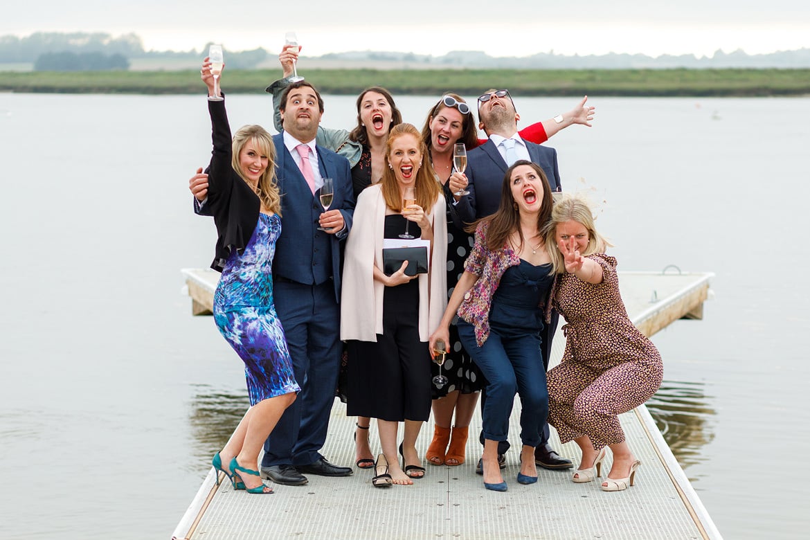 wedding guests posing at an aldeburgh wedding