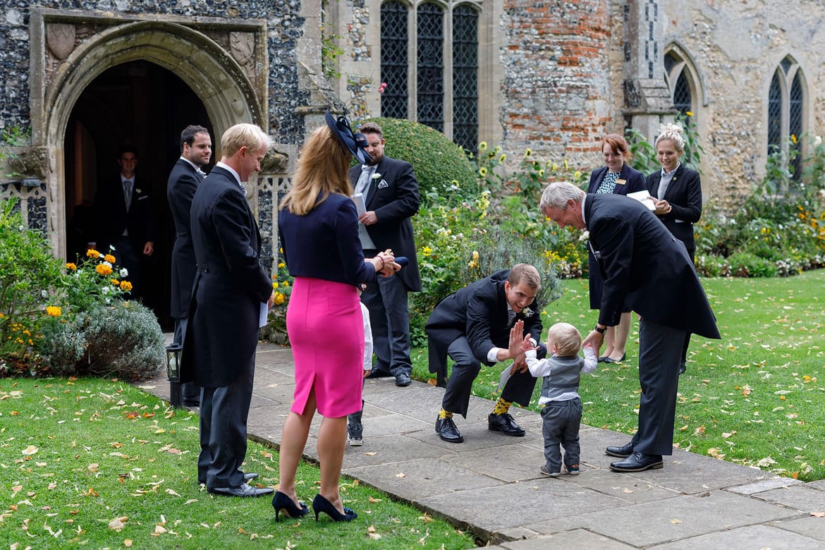 high fives at a hengrave hall wedding