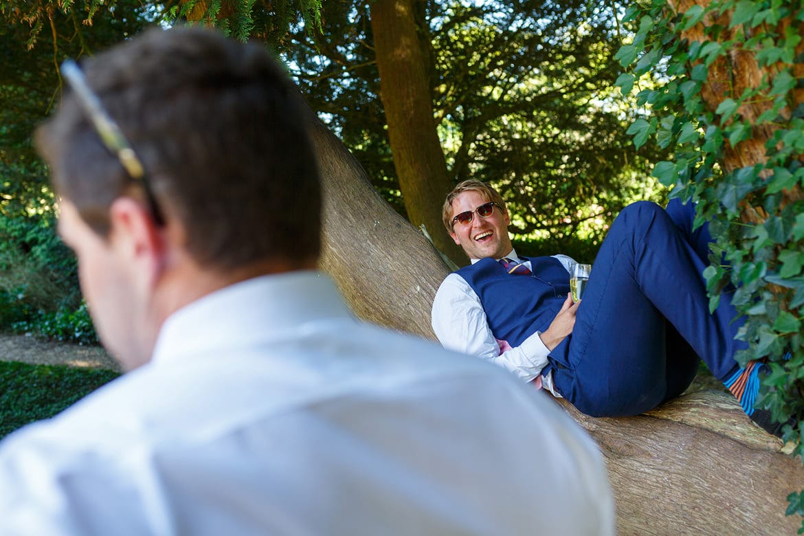 wedding guest in a tree at pennard house