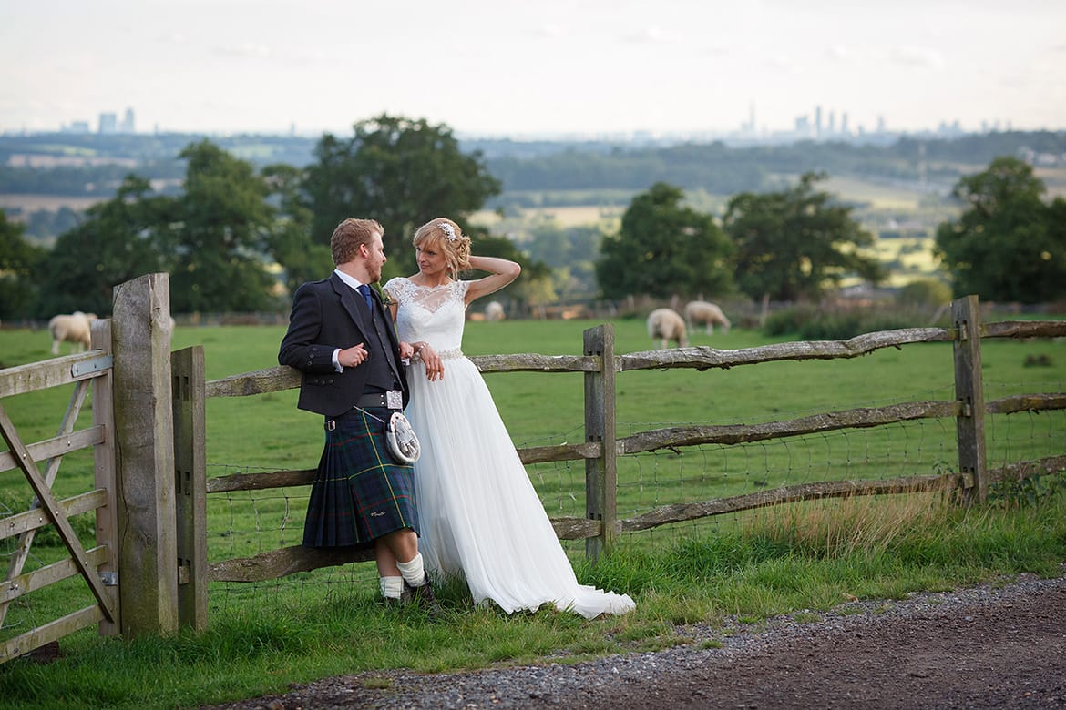 bride and groom take a moment out at gaynes park