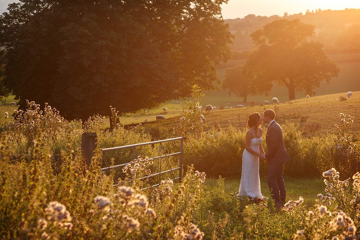 bride and groom in the sunshine at gaynes park