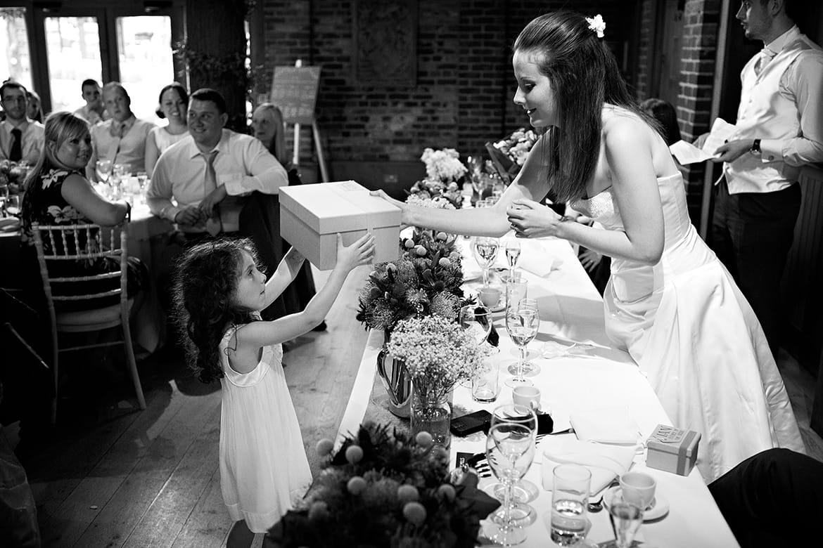 the bride gives a flowergirl a gift