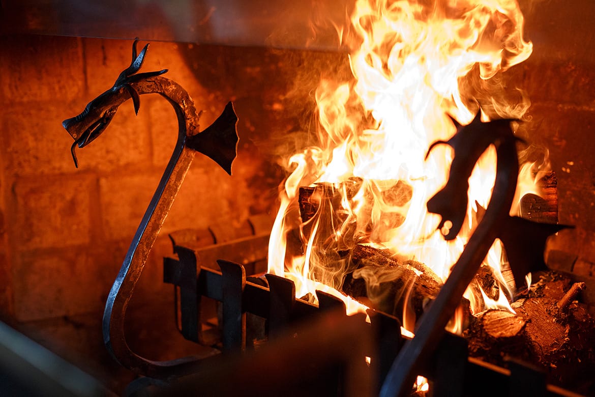 a roaring fire at a chaucer barn wedding