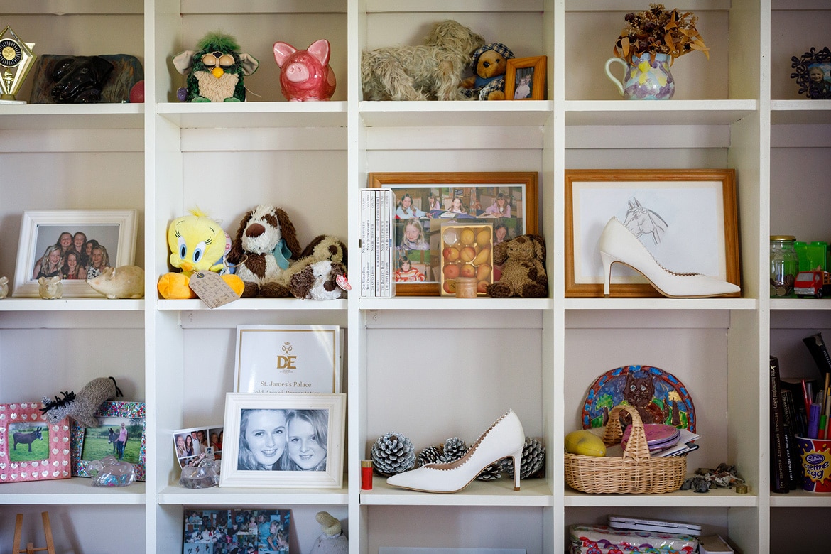 wedding shoes on the shelves in the brides bedroom