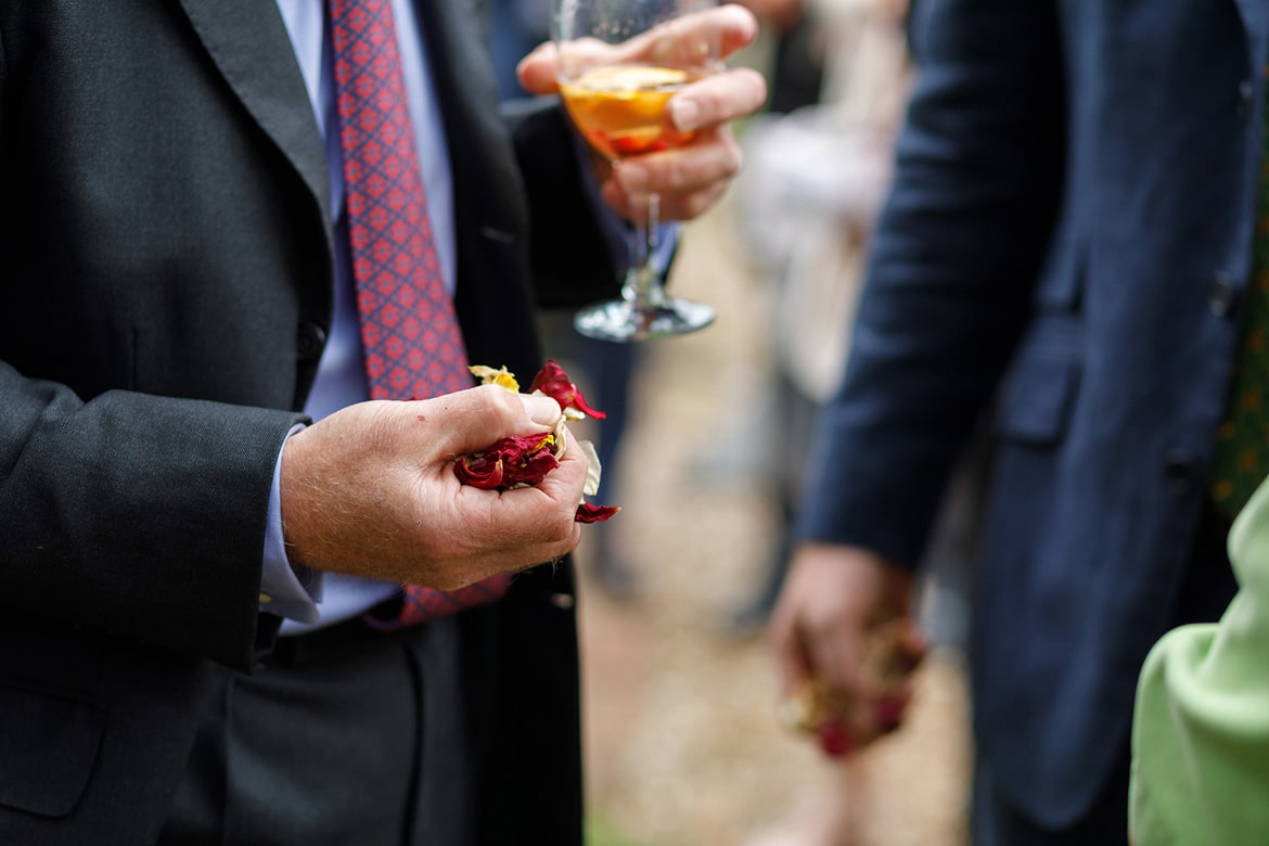 a wedding guest holds confetti