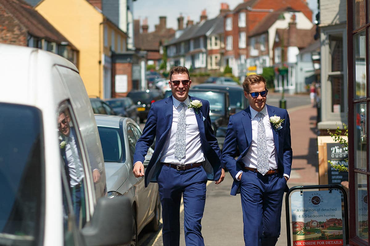 two ushers walk through cuckfield