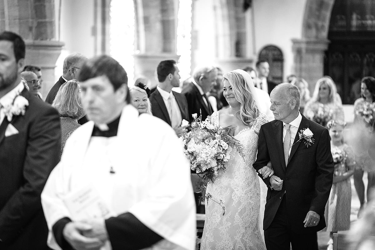 laura and her father walk down the aisle
