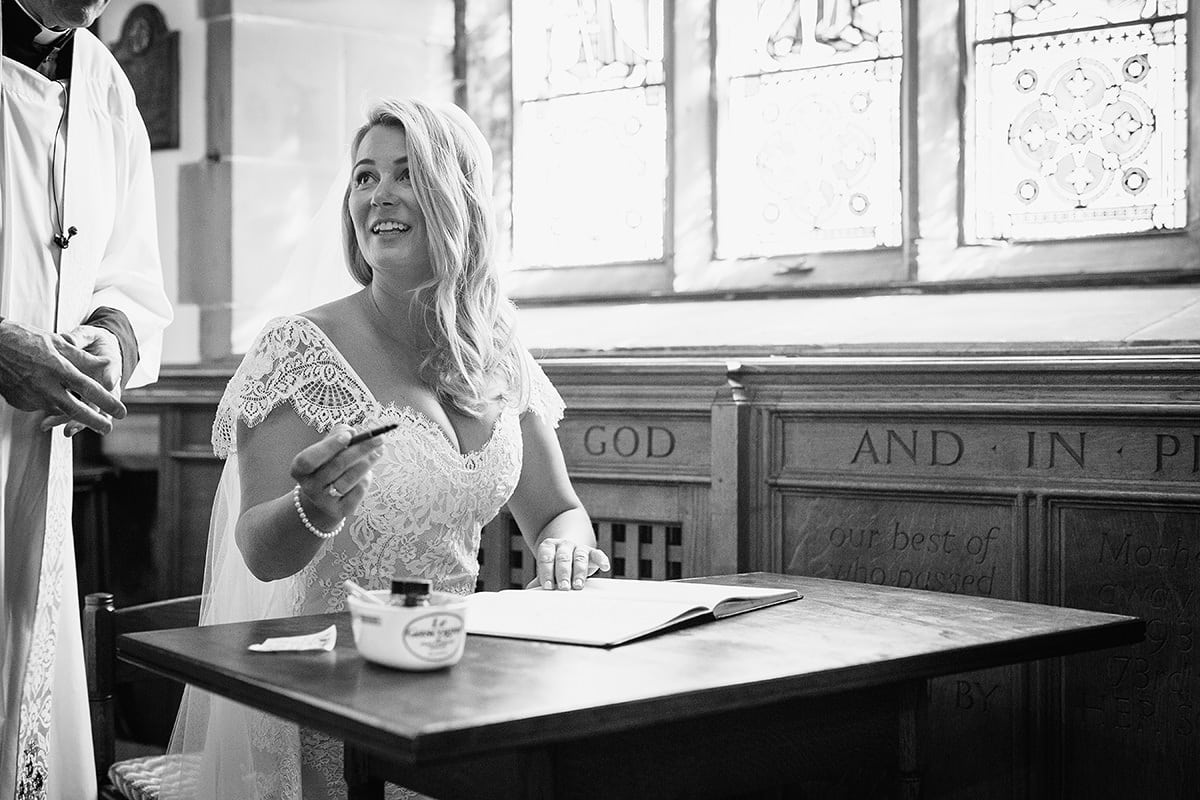 the bride signs the register