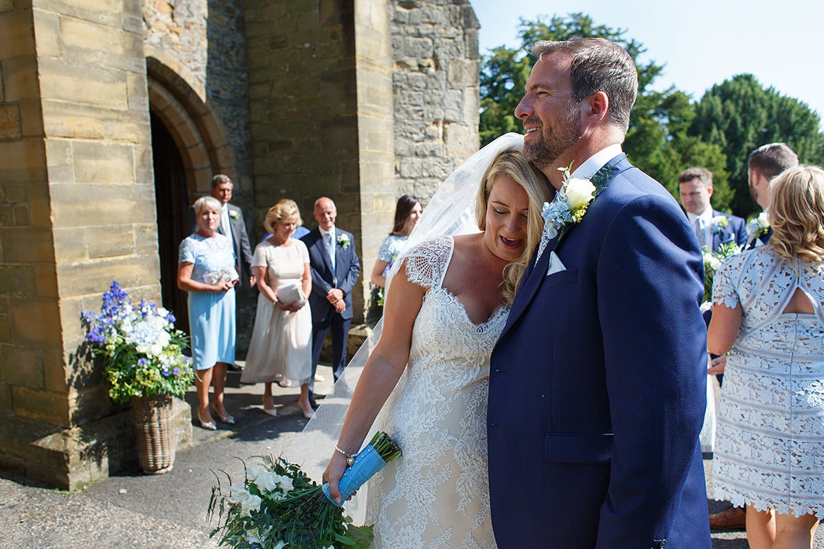 bride and groom outside cuckfield church