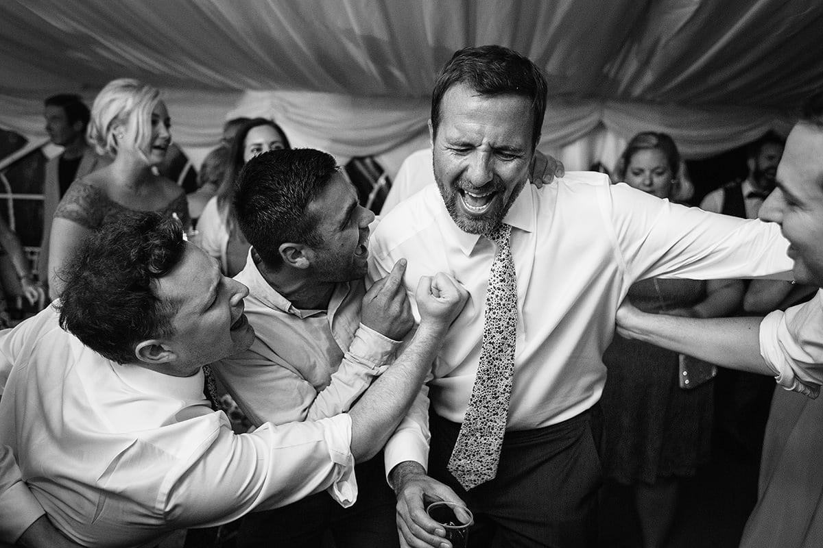 the groom dances with his buddies