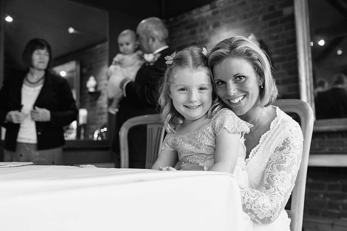 the bride and her daughter at the ceremony table