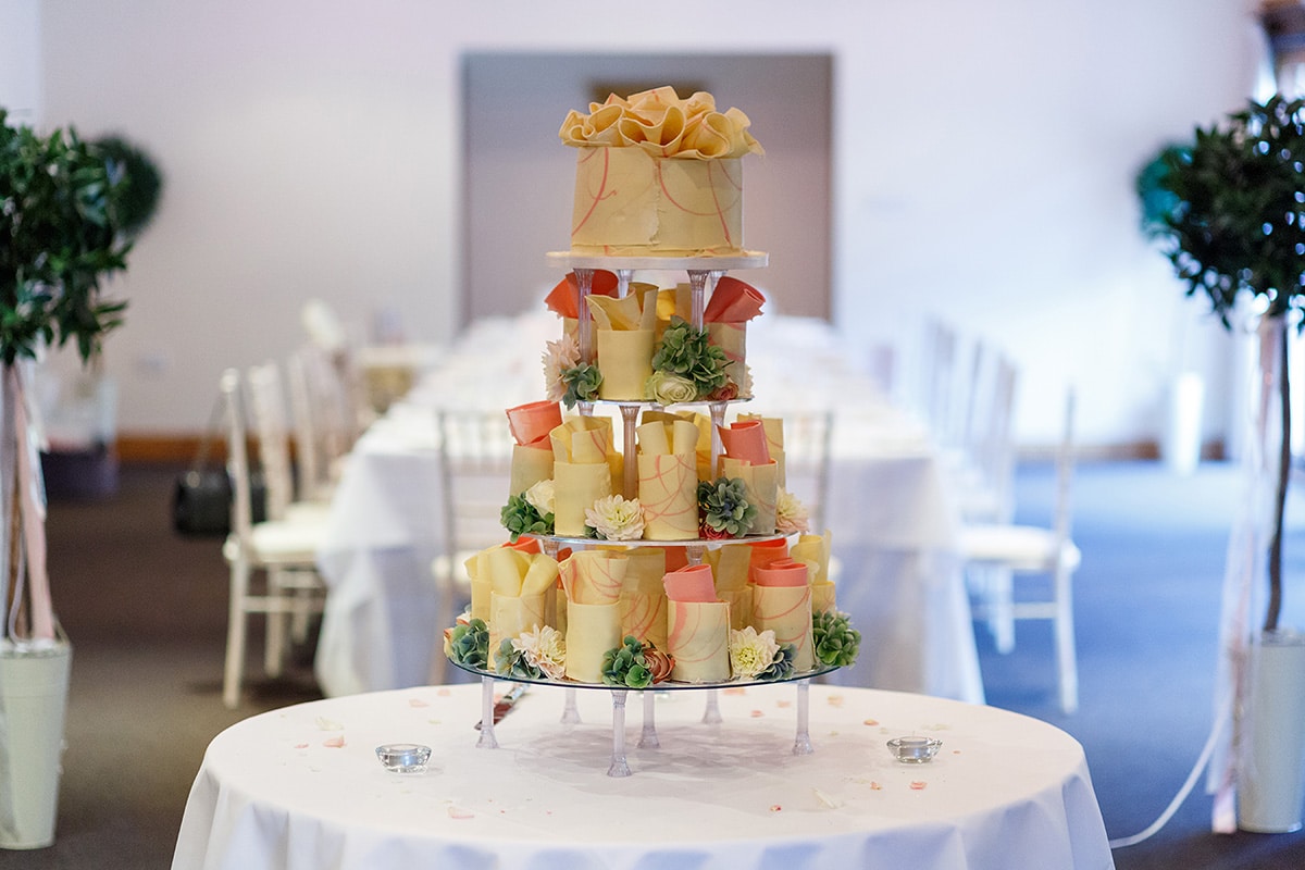 the wedding cake with the brasteds dining room in the background