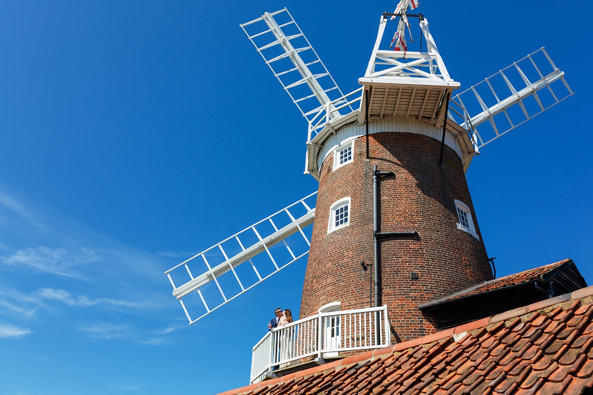 wedding photos on the balcony of cley windmill