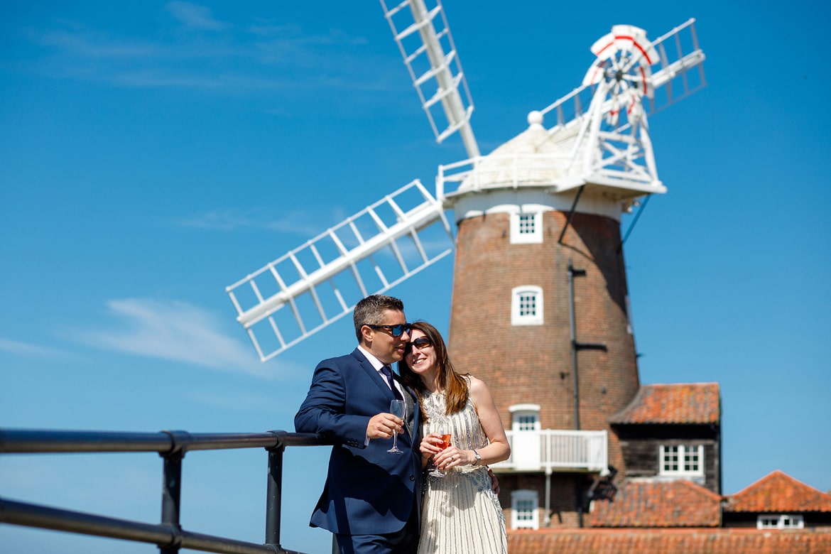 wedding portrait in the sunshine in front of cley mill