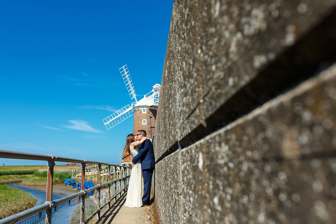 bride and groom by the river