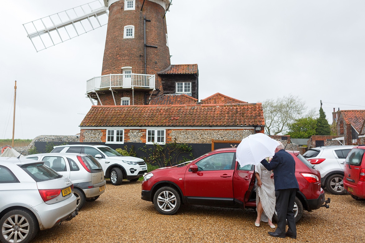 a bride arrives at cley mill