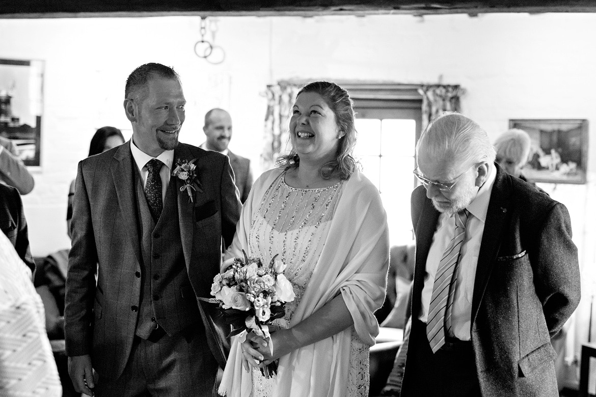 alice and simon laugh in the cley windmill ceremony room