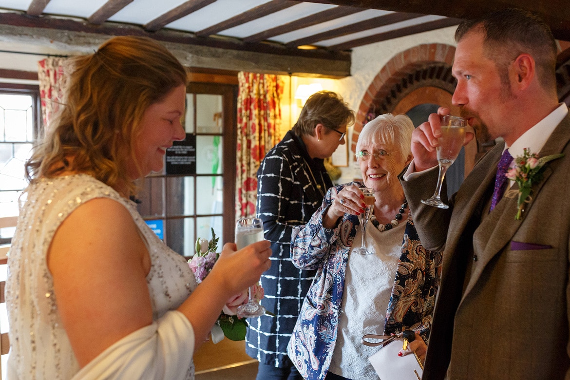 sharing a drink with guests