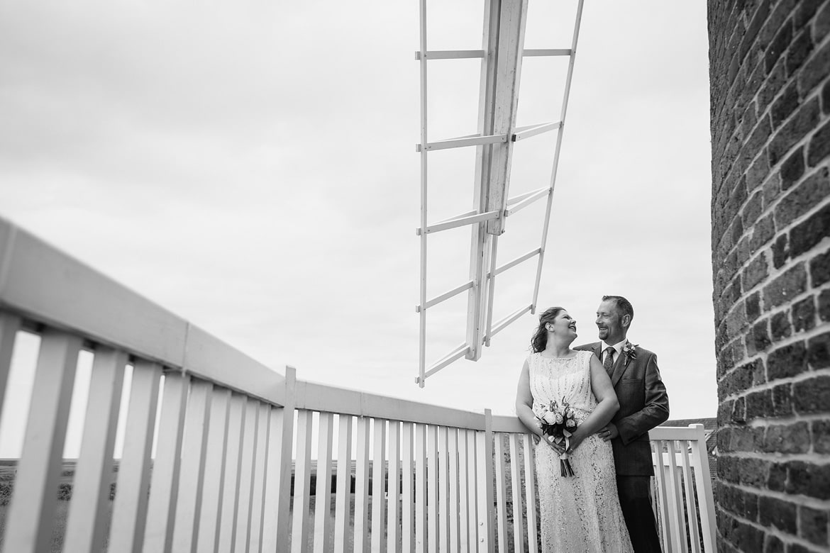 bride and groom on the balcony of cley windmill