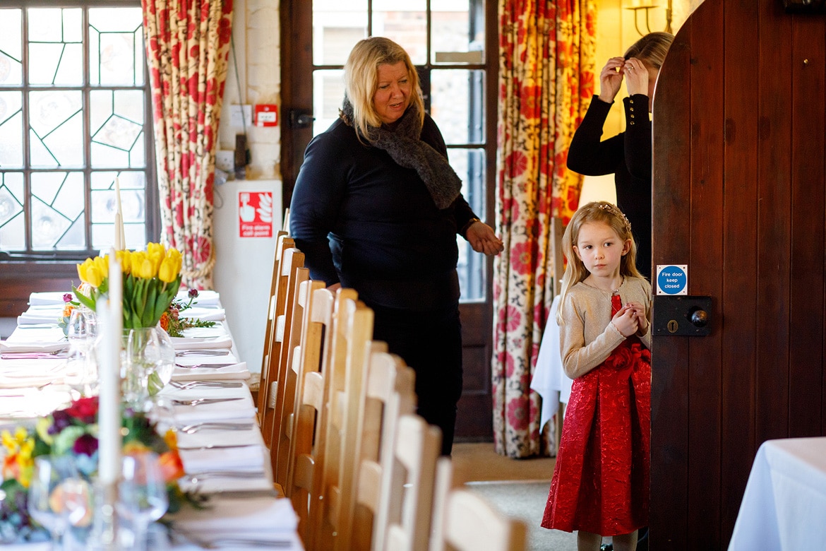 a flowergirl checks out the dining room