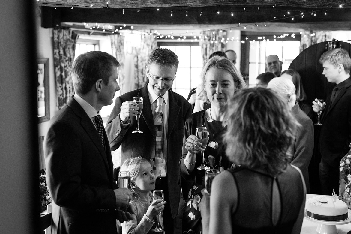 the couple and wedding guests at cley windmill