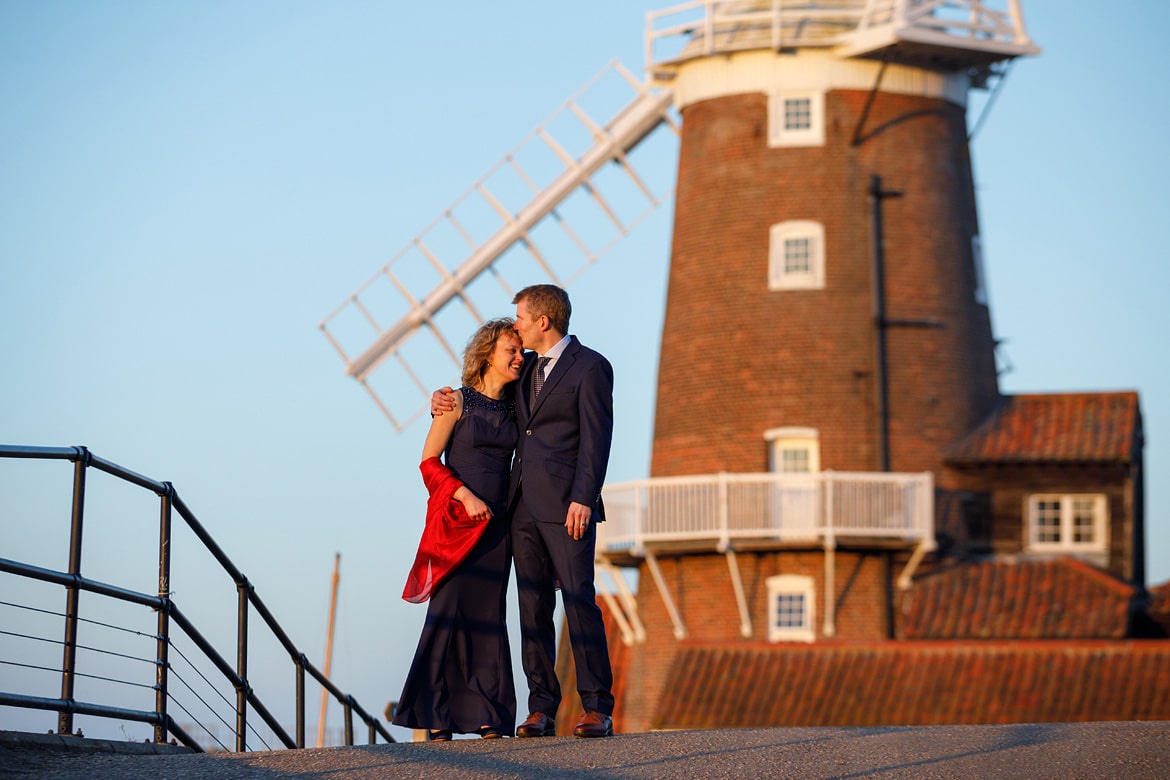 kissing with cley windmill in the background