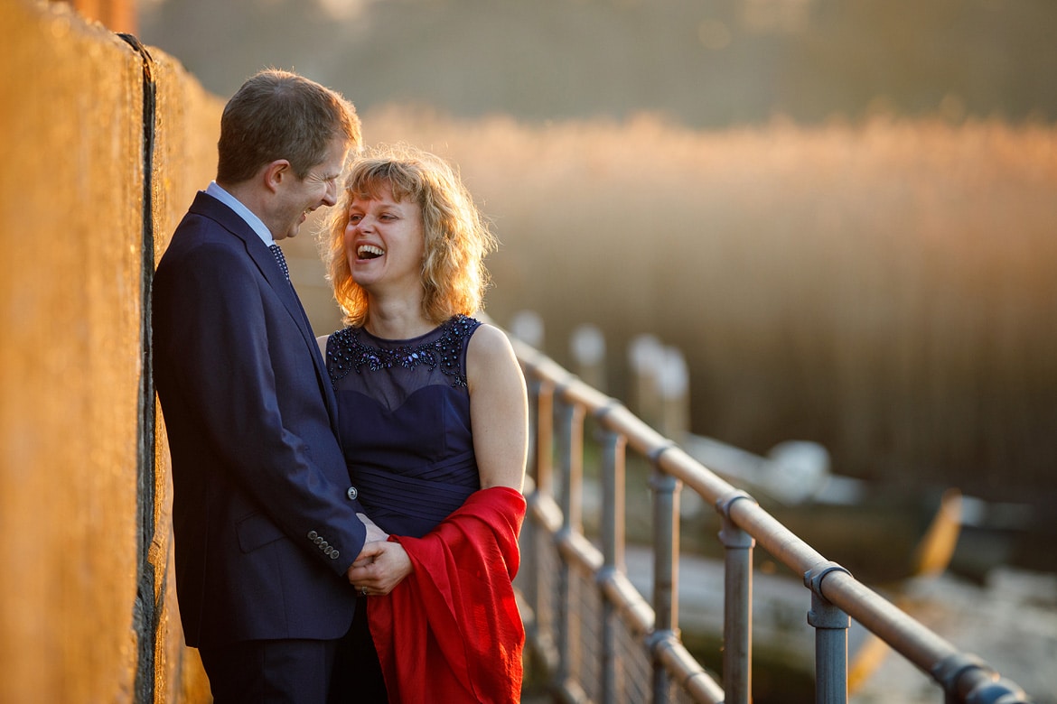 bride and groom laugh together